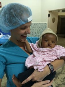 Photo of Sarah, resident, with one of the smaller patients