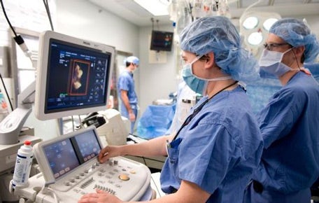 University of Virginia Anesthesiologists check the monitors in the operating room.