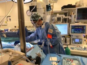 University of Virginia Recent Anesthesiology Graduate Dan Smith works on a patient in the OR .
