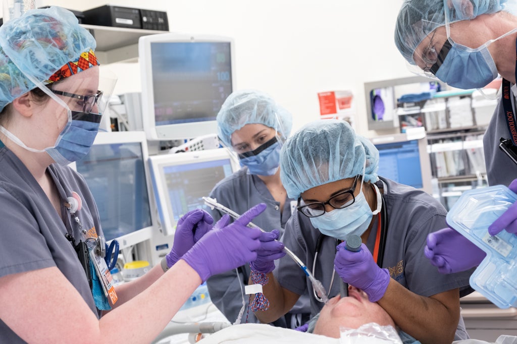University of Virginia Anesthesiology Residents perform an intubation on a patient.