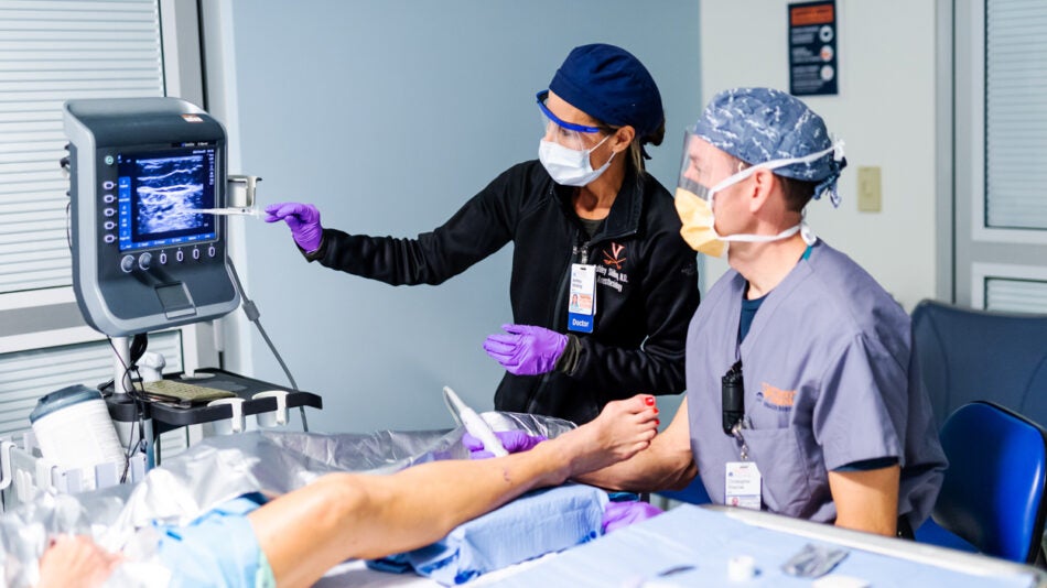Dr. Christopher Sharrow and Dr. Ashley Shilling use the Ultrasound to place a patient's nerve block.