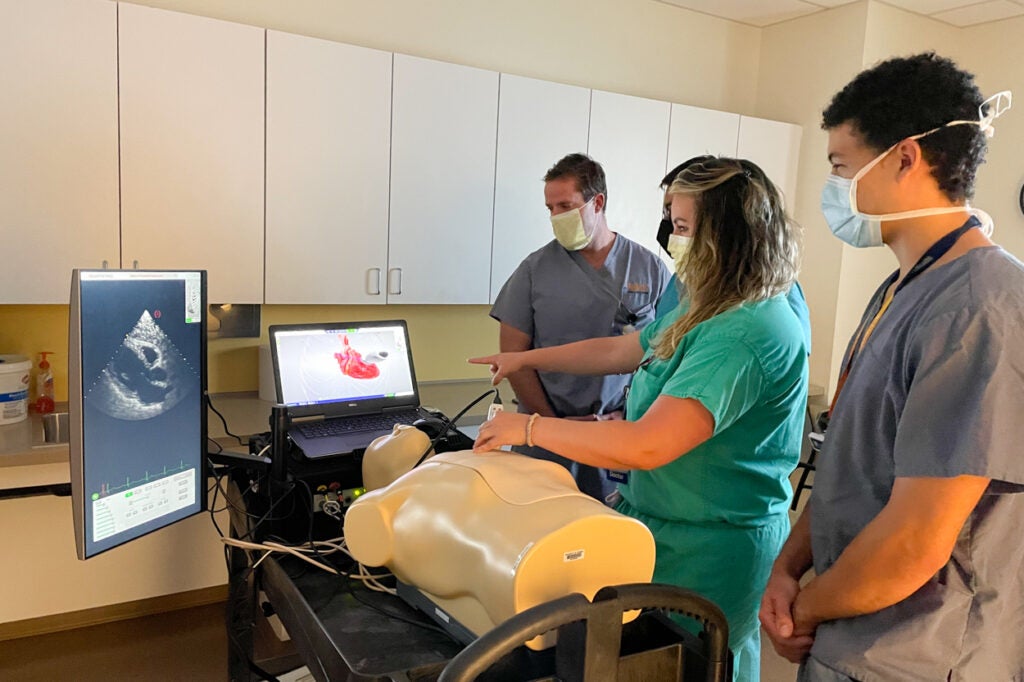 University of Virginia Residents perform cardiac POCUS during a teaching session with the HeartWorks simulator.