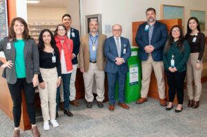 University of Virginia Dr. Bob Goldstein takes a photo with his team of the new Drug Take-Back Receptacle at UVA