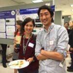 Picture of UVA student researchers taking in the poster submissions at UVA symposium.
