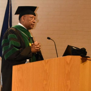 Dean speaking at graduation