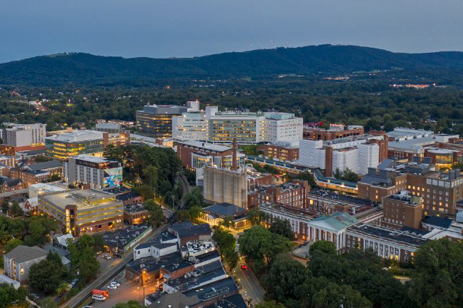 Aerial image of UVA hospital and research buildings at dusk facing west