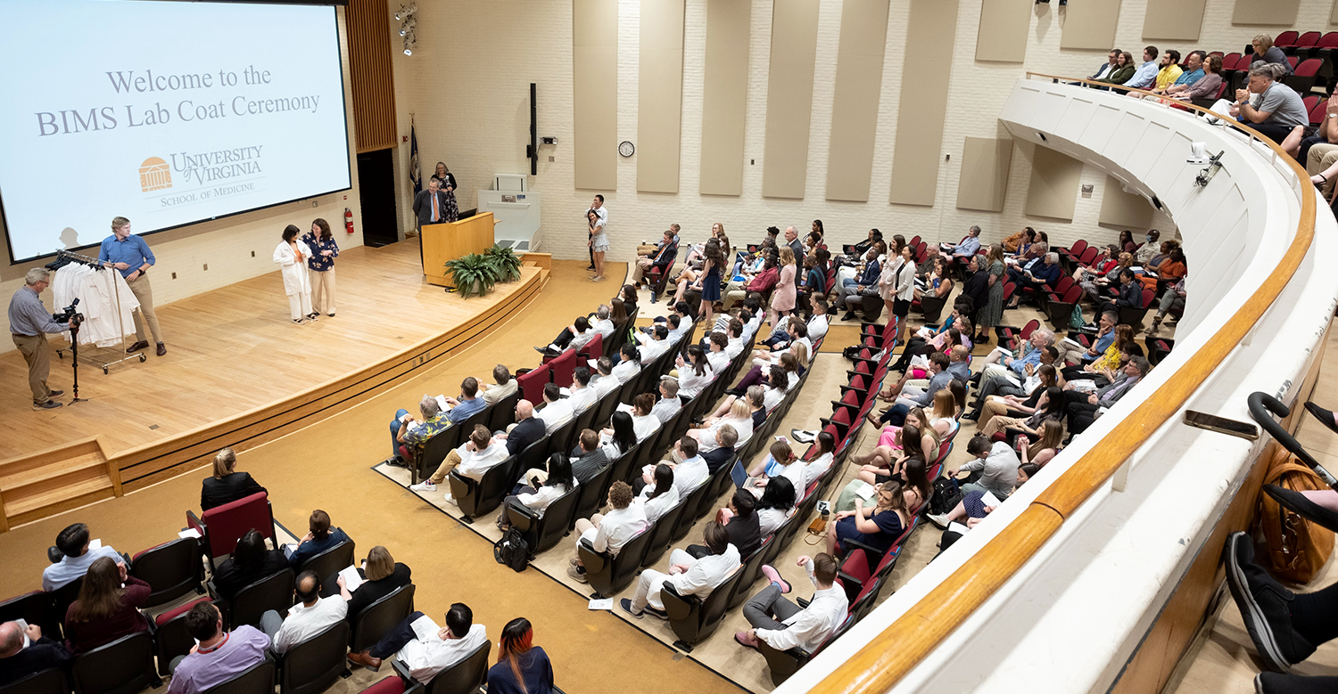 Spring 2022 lab coat ceremony image taken from balcony of auditorium looking down on audience.