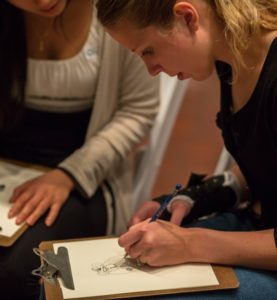 uva Students drawing on clip board