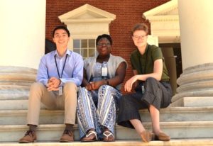 2019 interns, three interns sitting on steps smiling
