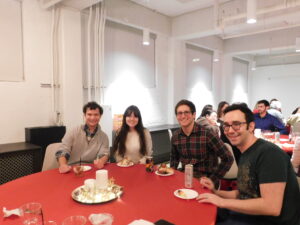 a Group of students and postdocs at a table