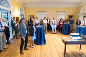 A group of people watching a presentation