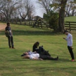 people laying in a field