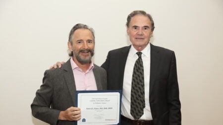 James P. Nataro, MD, PhD, MBA (left) was presented the Lifetime Achievement Award in Pediatric Science by R. Ariel Gomez, MD