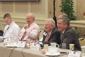 Ed Meese, Greg Saathoff, and Joel Dvoskin react to a humorous remark from across the hollow square.