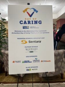 Day of Caring advertisement board with all the event Sponsor names