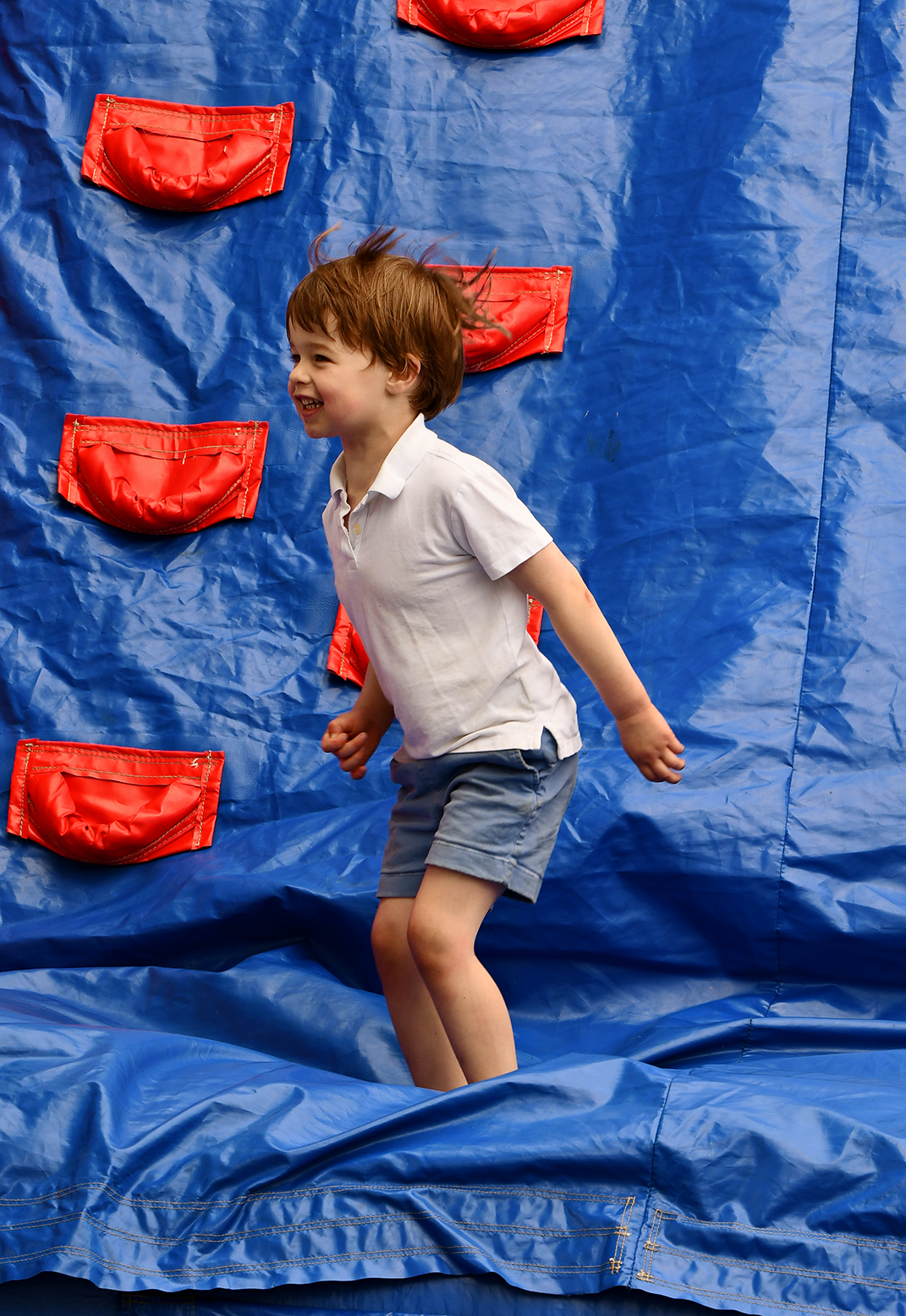 a child on a bounce house