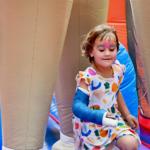 child on a bounce house