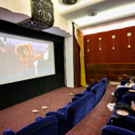children watching a movie in a theater