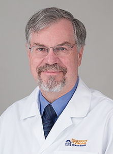 doctor Stephen Huff wearing his white lab coat