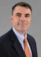 portrait of doctor Mark Sochor in a suit and tie