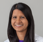 doctor Amita Sudhir wearing her white lab coat