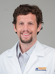 doctor Joshua Easter smiling and wearing a white lab coat