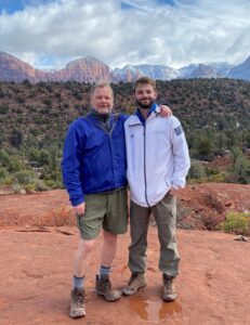 Zachary and friend hiking in western US landscape