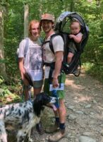 Grant Robinson on a hike with his wife, daughter, and dog