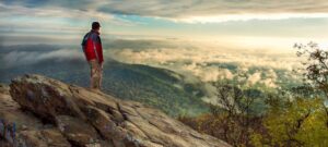 Photo of hiker on mountain top