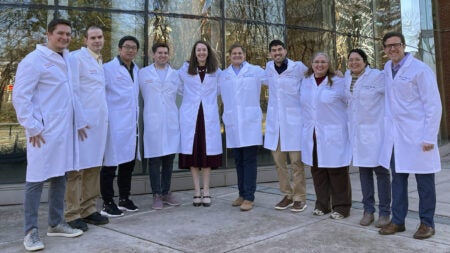 A group photo of lab members taken outside
