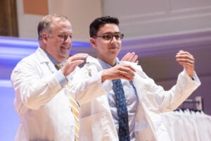 UVA Medical Student being presented with his White Coat