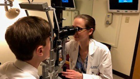 Picture of doctor performing eye exam