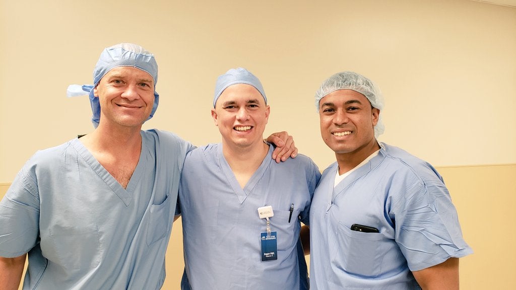 Drs. Awowale and Gwathmey visit with Dr. Chris Larson in Minneapolis
