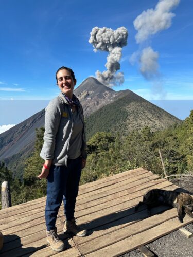 Photo of UVA Ortho Resident Kate Panzer, MD next to a volcano