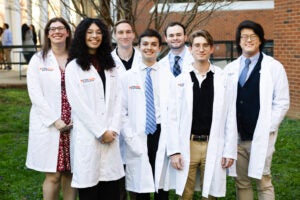 BIMS Students in white lab coats