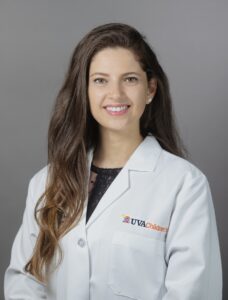 Sara Dogom wearing a lab coat