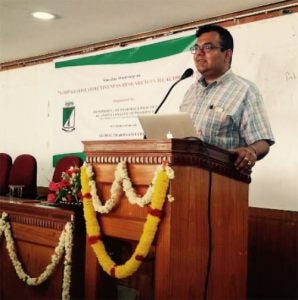 Prof. Balkrishnan speaks to an audience during a public health educational tour of Karnataka in India.