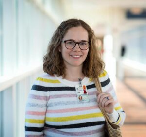 Jennifer Lobo smiling in sunny link between West Complex and Hospital