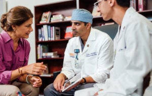 a patient working with SOM students