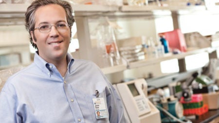 UVA Radiology Research Professor James Stone stands in a lab