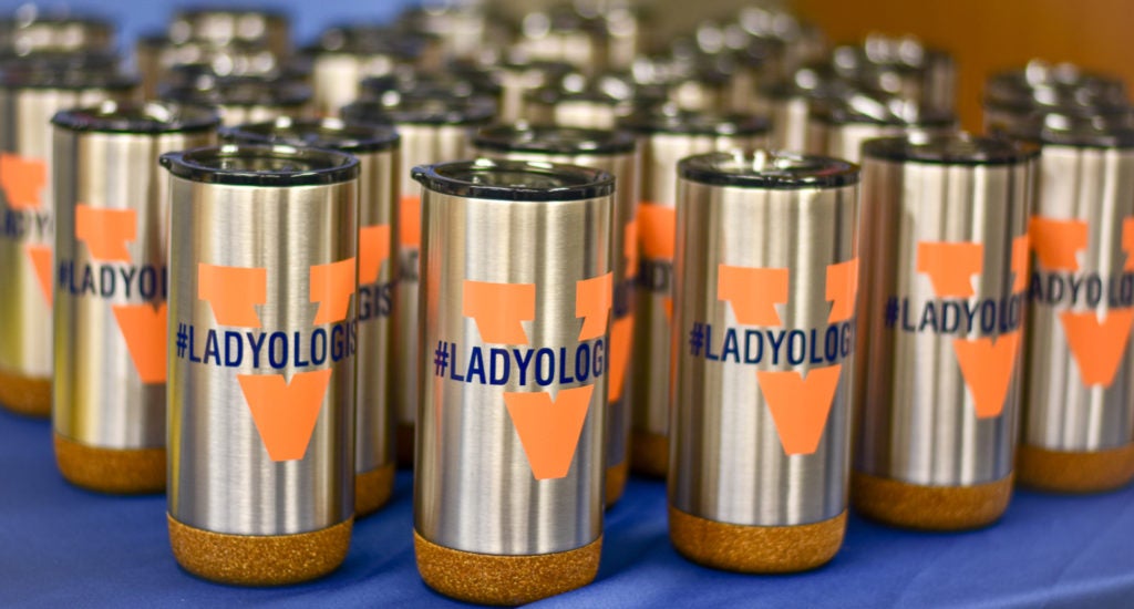 travel mugs with the UVA Radiology #Ladyologist logo on them