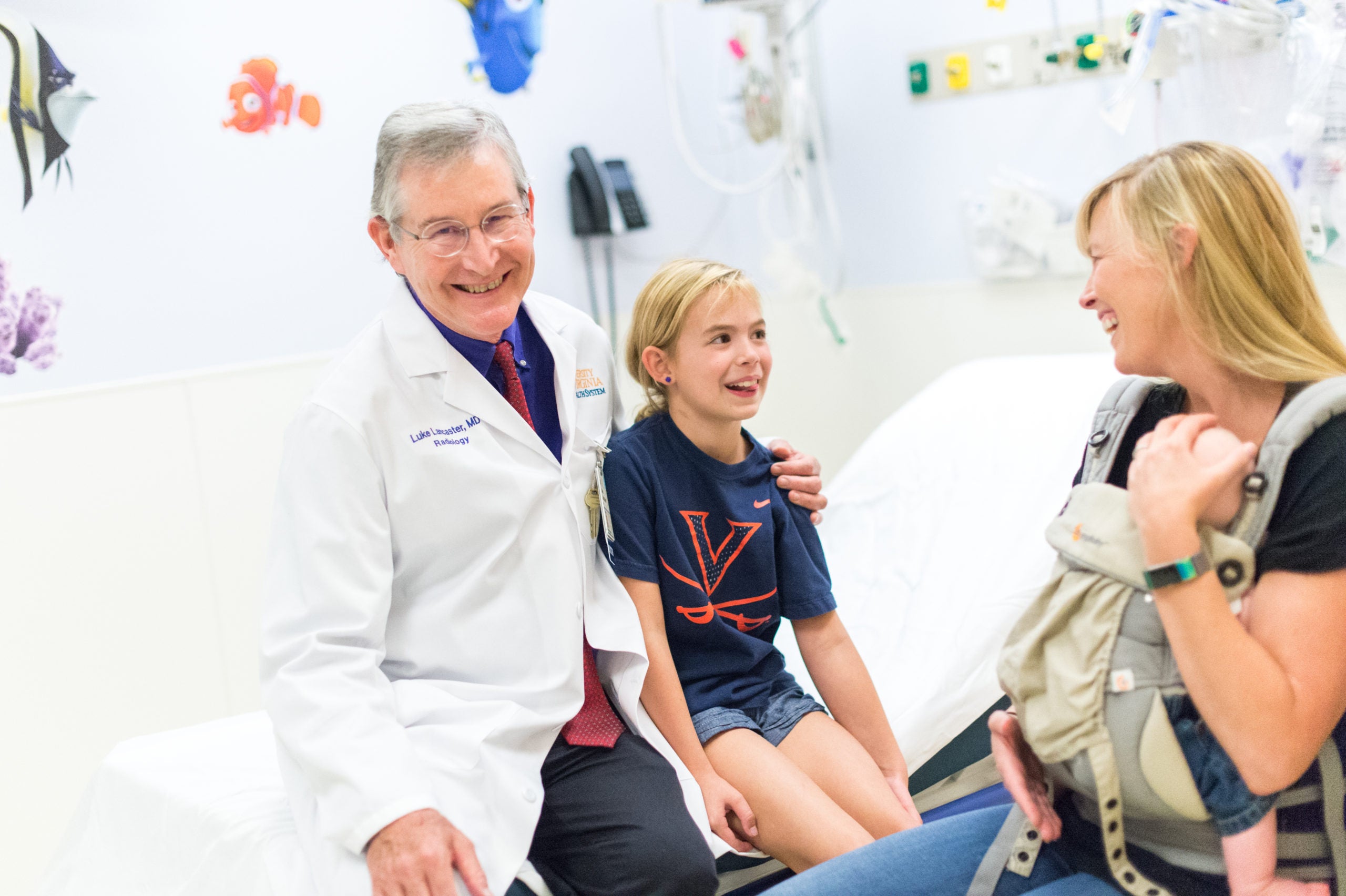 Dr. Luke Lancaster, Associate Professor of Pediatric Imaging, with a young patient