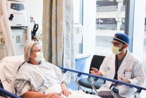 UVA Interventional Radiology Resident Yasser El-Abd talks with a patient