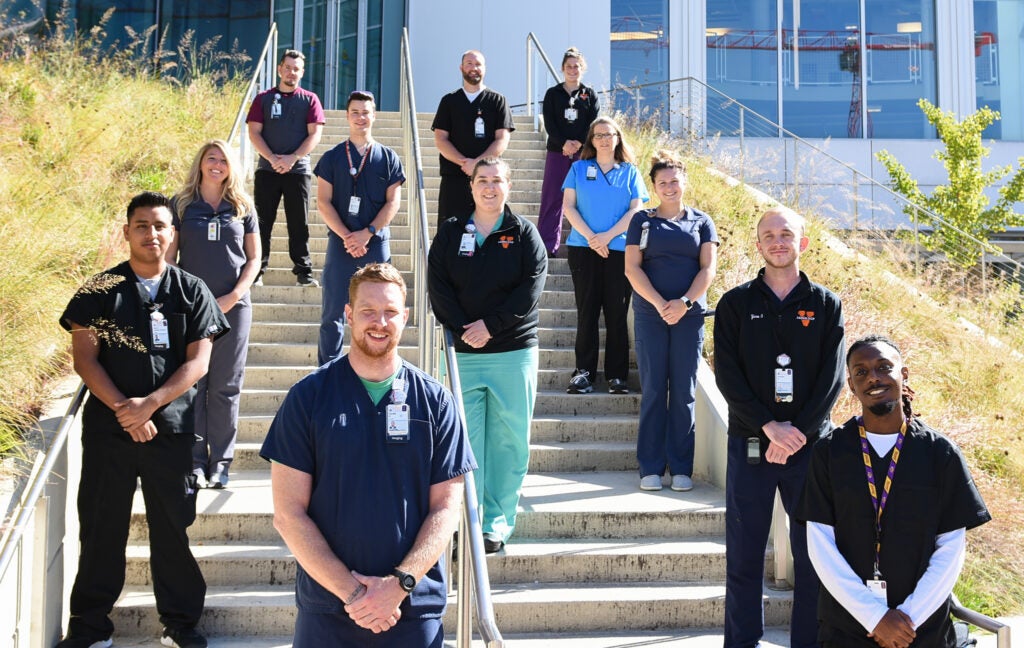 UVA Radiology CT team poses in front of the Education Resource Center (ERC)
