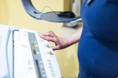 UVA Radiology mammography tech operates mammography scanner