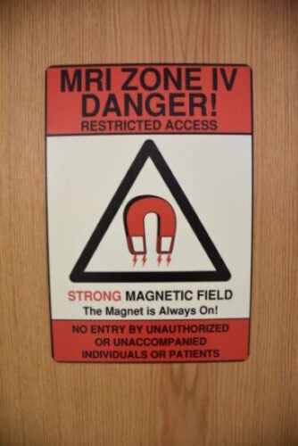 Sign warning about the dangers of the MRI's strong magnetic field