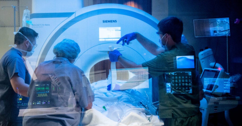 The UVA MRI team prepares and positions a patient in the scan room