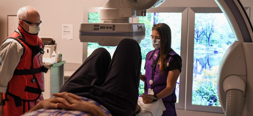 UVA Radiology musculoskeletal faculty and fellow position a patient in the new Orthopedic Outpatient Center