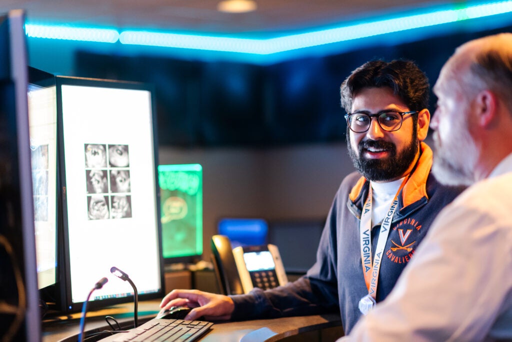 A Diagnostic Radiology resident looks at a scan with a professor