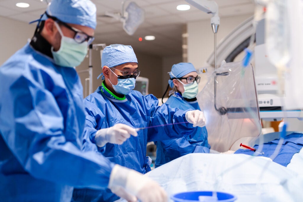 Interventional radiologists performing a procedure